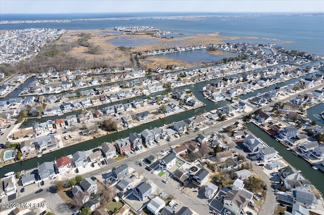 birds eye view of property with a residential view and a water view