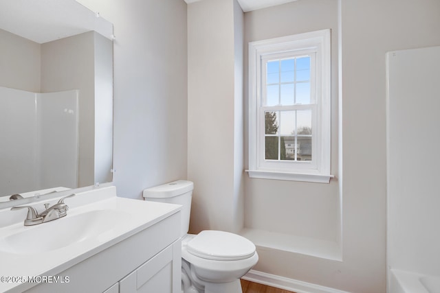 full bathroom featuring a shower, toilet, and vanity