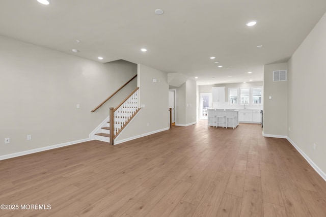 75 Driftwood Cir, Oceanport, NJ 07757 - unfurnished living room featuring visible vents, recessed lighting, and light wood-style flooring