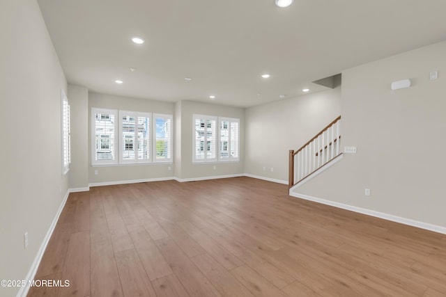75 Driftwood Cir, Oceanport, NJ 07757 - unfurnished living room with recessed lighting, baseboards, stairway, and light wood-style floors