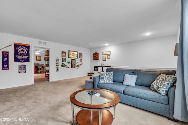 living area with recessed lighting, carpet, baseboards, and visible vents