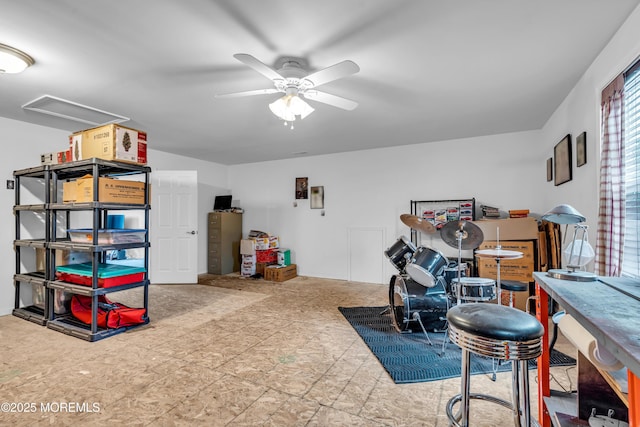 playroom featuring attic access and a ceiling fan