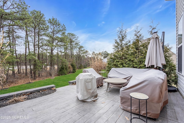 view of patio featuring grilling area and a deck