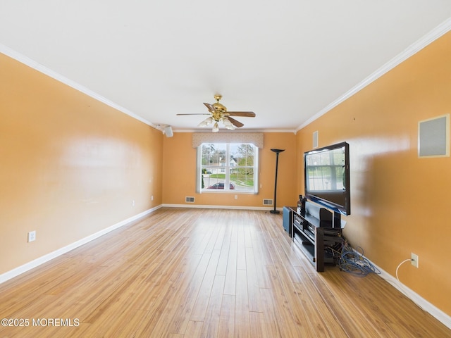 unfurnished living room featuring light wood-style floors, ceiling fan, visible vents, baseboards, and ornamental molding