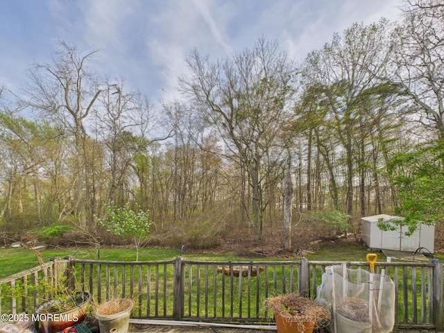 deck with an outdoor structure and a storage unit