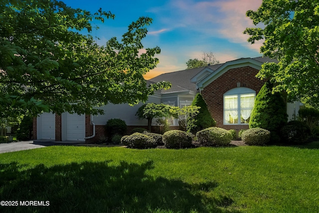1505 Wishing Well Ln, Manasquan, NJ 08736 - view of front of house featuring brick siding, a front yard, and a garage