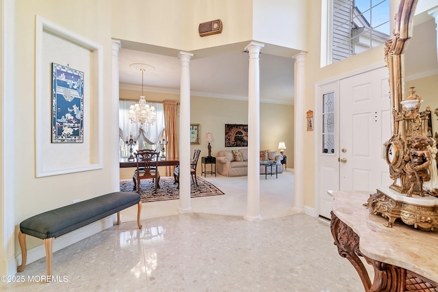 1505 Wishing Well Ln, Manasquan, NJ 08736 - entryway with ornamental molding, baseboards, ornate columns, a chandelier, and a towering ceiling
