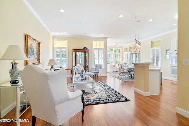 1505 Wishing Well Ln, Manasquan, NJ 08736 - living area with crown molding, light wood finished floors, baseboards, a ceiling fan, and recessed lighting