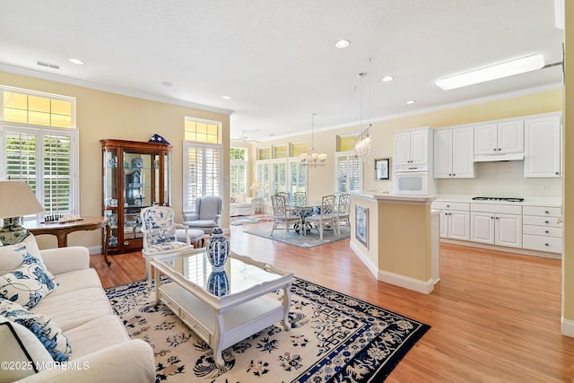 1505 Wishing Well Ln, Manasquan, NJ 08736 - living room with crown molding, a chandelier, light wood finished floors, recessed lighting, and baseboards