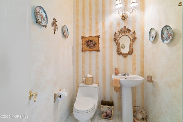 1505 Wishing Well Ln, Manasquan, NJ 08736 - half bathroom with toilet, tile patterned floors, wallpapered walls, and a sink