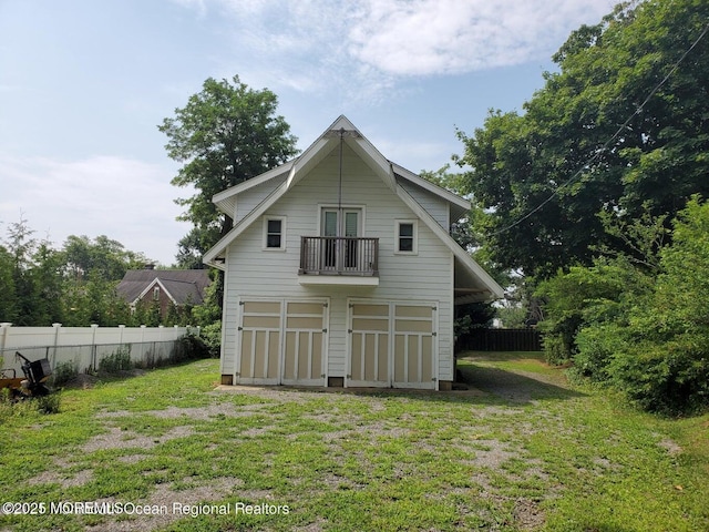 92 Compton St, Belford, NJ 07718 - back of house with a balcony, fence, and a yard