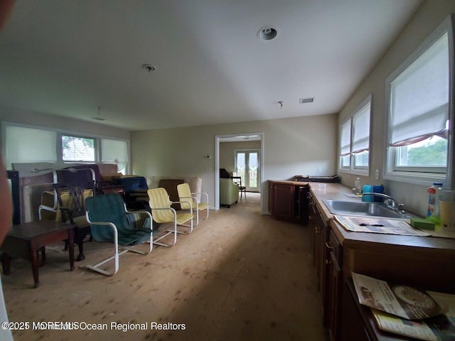 92 Compton St, Belford, NJ 07718 - interior space featuring visible vents, light wood-style floors, a sink, and a healthy amount of sunlight