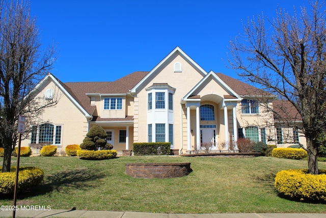 2 Lecarre Dr, Marlboro, NJ 07746 - traditional-style house with stucco siding and a front lawn