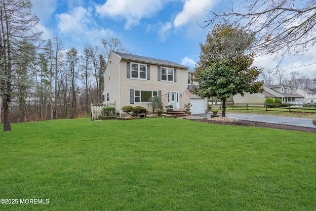 115 Leesville Rd, Jackson, NJ 08527 - view of front of house with a garage, driveway, fence, and a front lawn
