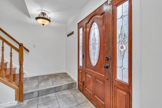 115 Leesville Rd, Jackson, NJ 08527 - entryway featuring light tile patterned floors, baseboards, and stairway