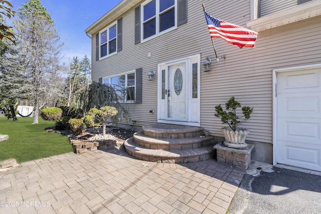 115 Leesville Rd, Jackson, NJ 08527 - view of exterior entry with a yard and a garage