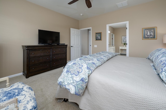 bedroom featuring light carpet, ensuite bathroom, baseboards, visible vents, and ceiling fan
