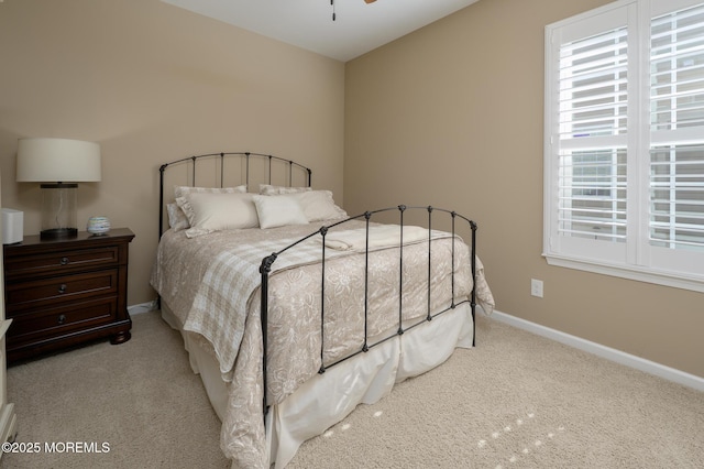 bedroom with baseboards and carpet floors