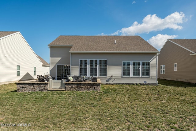 back of house featuring a lawn and a patio