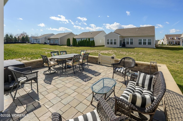 view of patio / terrace with outdoor lounge area, outdoor dining space, and a residential view