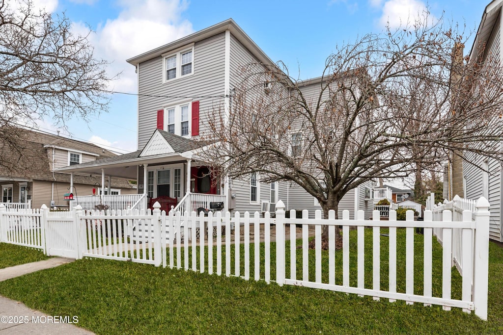 612 16th Ave, Belmar, NJ 07719 - view of front facade with a fenced front yard, a porch, and a front yard