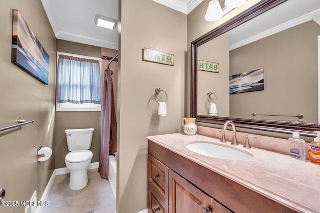 bathroom with vanity, toilet, ornamental molding, baseboards, and tile patterned floors