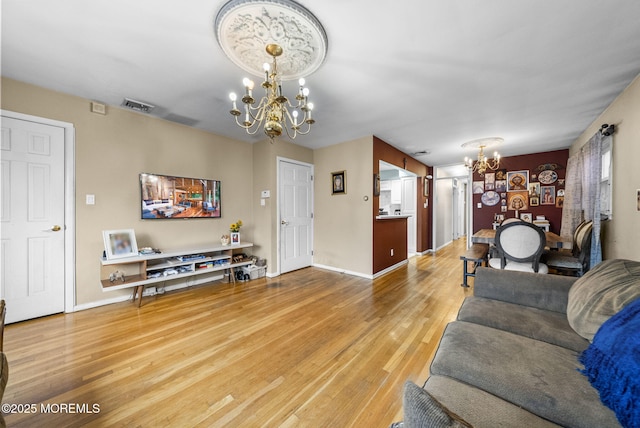 2776 John F Kennedy Blvd, Jersey City, NJ 07306 - living room with baseboards, visible vents, an inviting chandelier, and wood finished floors