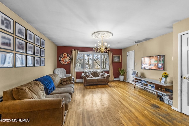 2776 John F Kennedy Blvd, Jersey City, NJ 07306 - living room featuring a chandelier, baseboards, wood finished floors, baseboard heating, and a baseboard heating unit