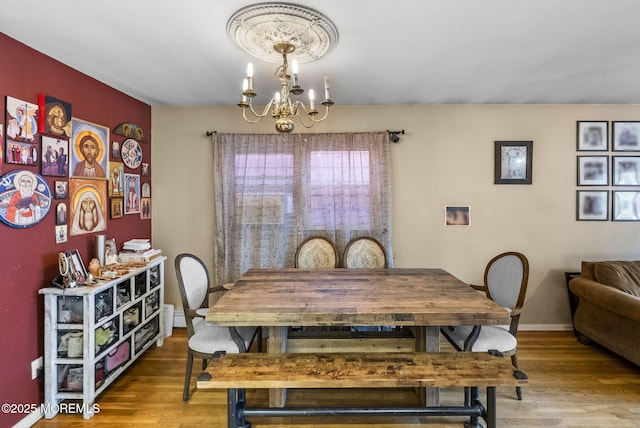 2776 John F Kennedy Blvd, Jersey City, NJ 07306 - dining room with baseboards, wood finished floors, and a chandelier