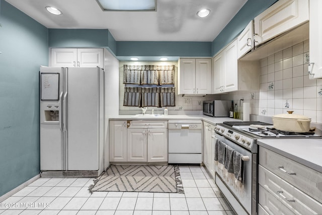 2776 John F Kennedy Blvd, Jersey City, NJ 07306 - kitchen featuring light countertops, a sink, stainless steel appliances, and backsplash