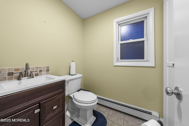 2776 John F Kennedy Blvd, Jersey City, NJ 07306 - half bath with toilet, vanity, a baseboard heating unit, and decorative backsplash