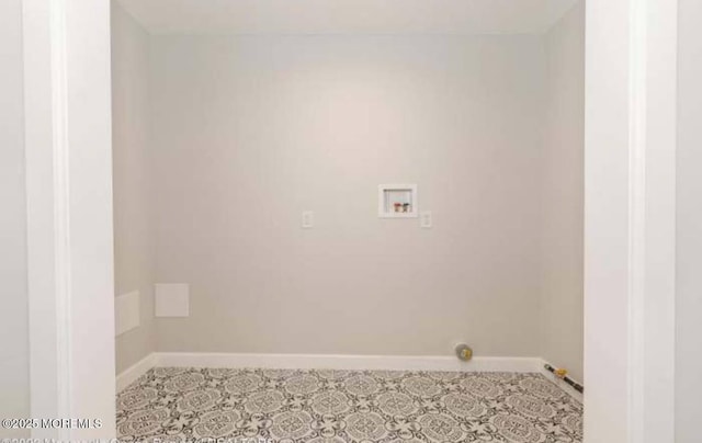 washroom featuring hookup for a washing machine, baseboards, and laundry area