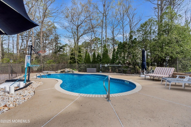 view of pool featuring fence, a diving board, a patio area, and a fenced in pool