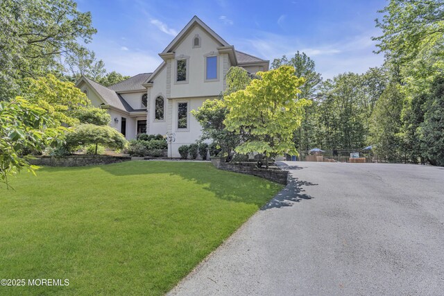 6 Canterbury Ct, Jackson, NJ 08527 - view of front facade with stucco siding and a front lawn