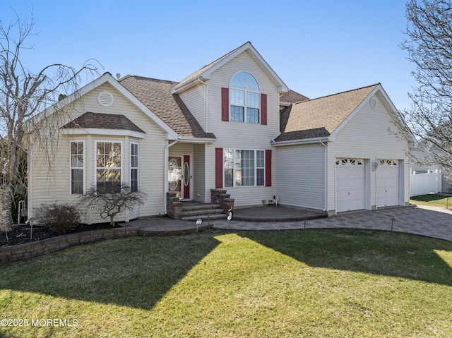 traditional-style home with driveway, a shingled roof, a front lawn, and an attached garage