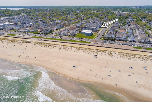 aerial perspective of suburban area featuring expansive beach