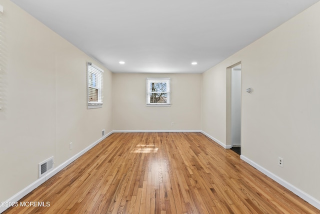 89 Barkalow Ave, Freehold, NJ 07728 - unfurnished room featuring visible vents, baseboards, recessed lighting, and light wood-style floors