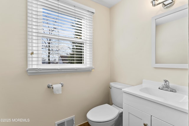89 Barkalow Ave, Freehold, NJ 07728 - half bathroom featuring vanity, visible vents, and toilet