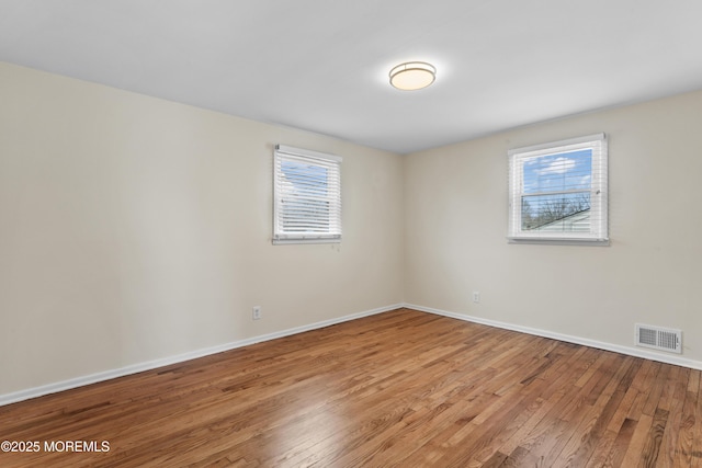 89 Barkalow Ave, Freehold, NJ 07728 - empty room featuring visible vents, baseboards, and light wood finished floors