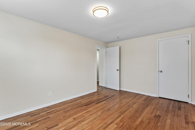 89 Barkalow Ave, Freehold, NJ 07728 - unfurnished bedroom featuring wood finished floors and baseboards