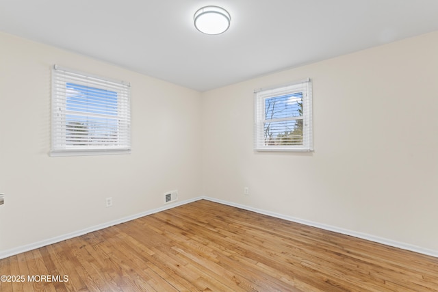 89 Barkalow Ave, Freehold, NJ 07728 - unfurnished room featuring visible vents, light wood-style flooring, and baseboards
