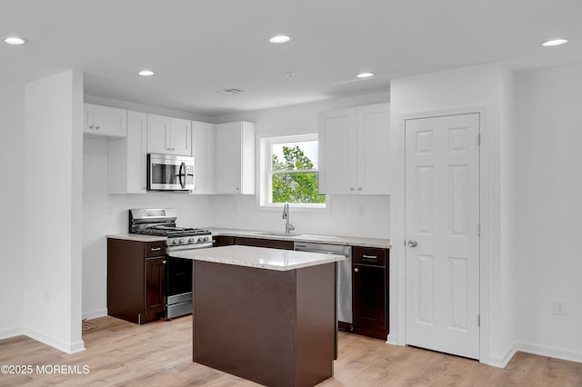 42 W Shore St, Keansburg, NJ 07734 - kitchen featuring appliances with stainless steel finishes, a sink, recessed lighting, a kitchen island, and light wood finished floors