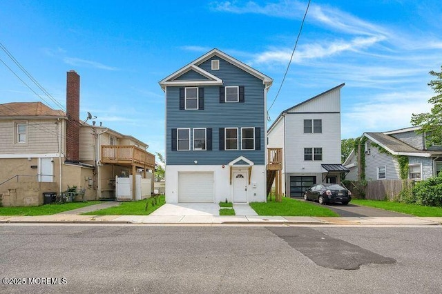 42 W Shore St, Keansburg, NJ 07734 - view of front of home featuring an attached garage, concrete driveway, and stucco siding