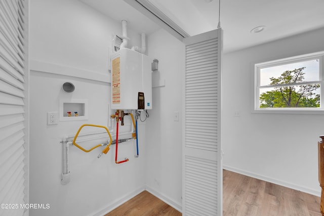 42 W Shore St, Keansburg, NJ 07734 - corridor featuring water heater, wood finished floors, and baseboards