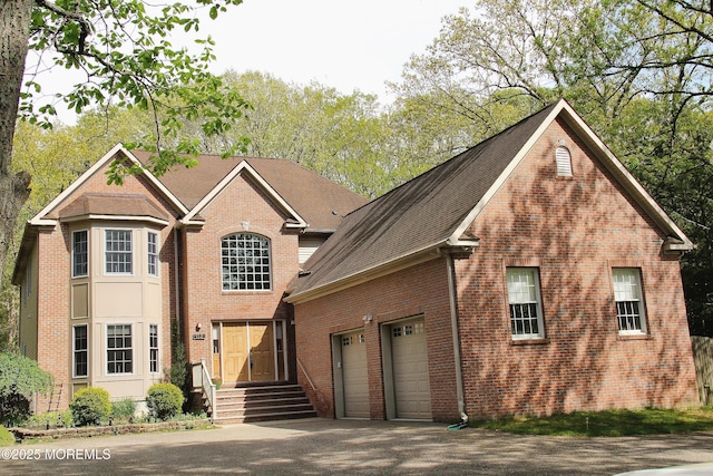 113 Willow Dr, Jackson, NJ 08527 - traditional-style home with a garage, a shingled roof, aphalt driveway, and brick siding