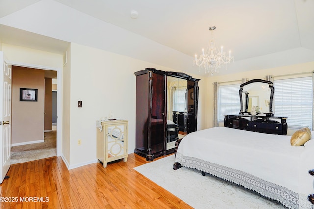 19 Summerhill Ave, Jackson, NJ 08527 - bedroom with baseboards, light wood-type flooring, and an inviting chandelier