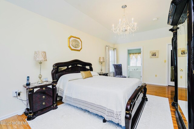 19 Summerhill Ave, Jackson, NJ 08527 - bedroom with wood finished floors, a notable chandelier, baseboards, and connected bathroom