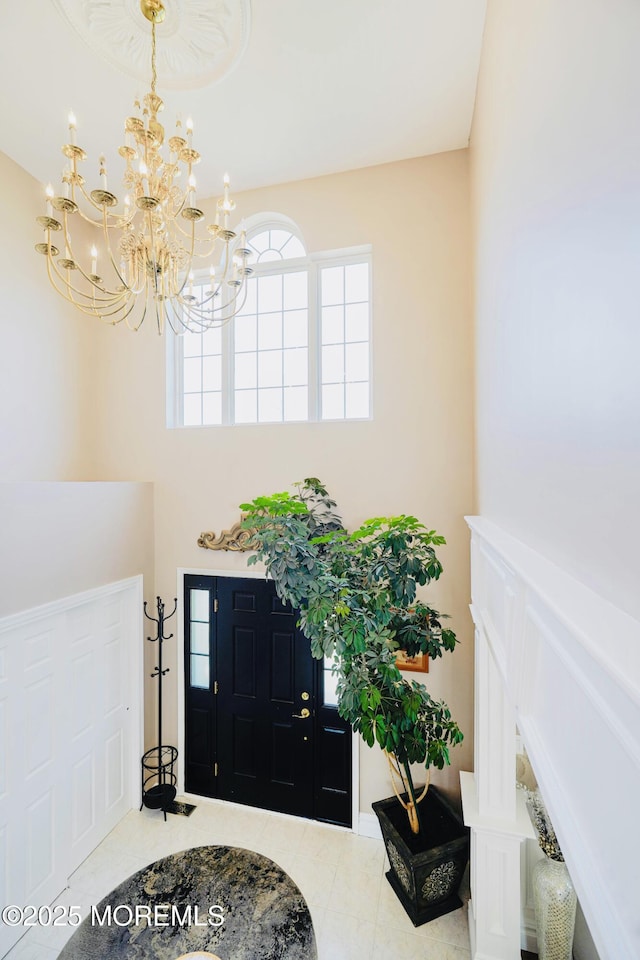 19 Summerhill Ave, Jackson, NJ 08527 - entrance foyer with tile patterned floors, a notable chandelier, and a towering ceiling