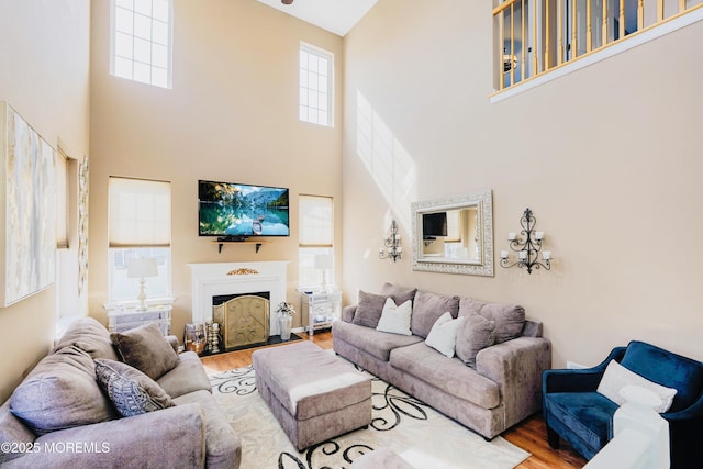 19 Summerhill Ave, Jackson, NJ 08527 - living room featuring wood finished floors, a towering ceiling, and a healthy amount of sunlight