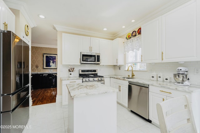 19 Summerhill Ave, Jackson, NJ 08527 - kitchen featuring light stone counters, white cabinetry, crown molding, appliances with stainless steel finishes, and a sink
